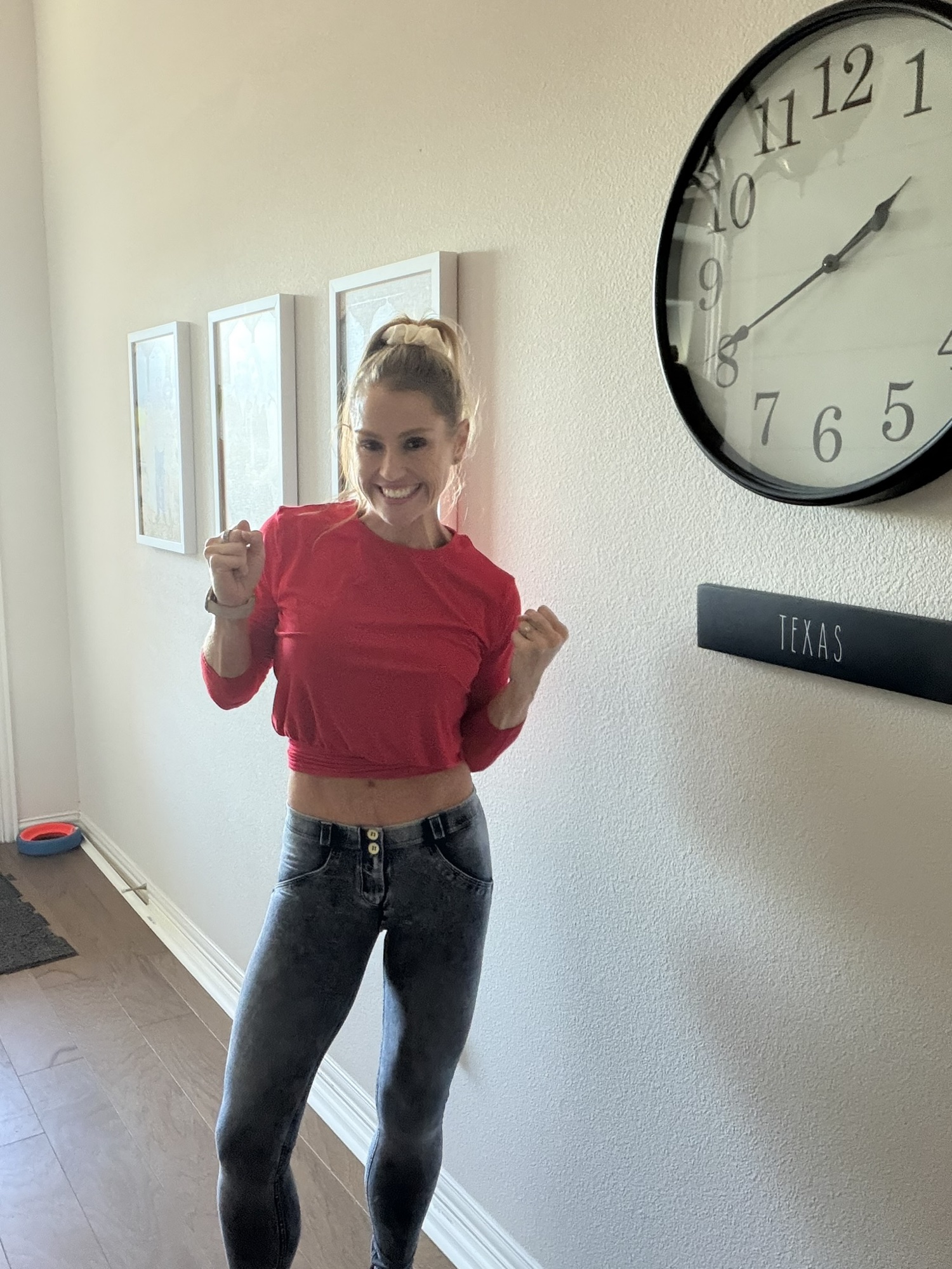 Gen at home, fists up and smiling